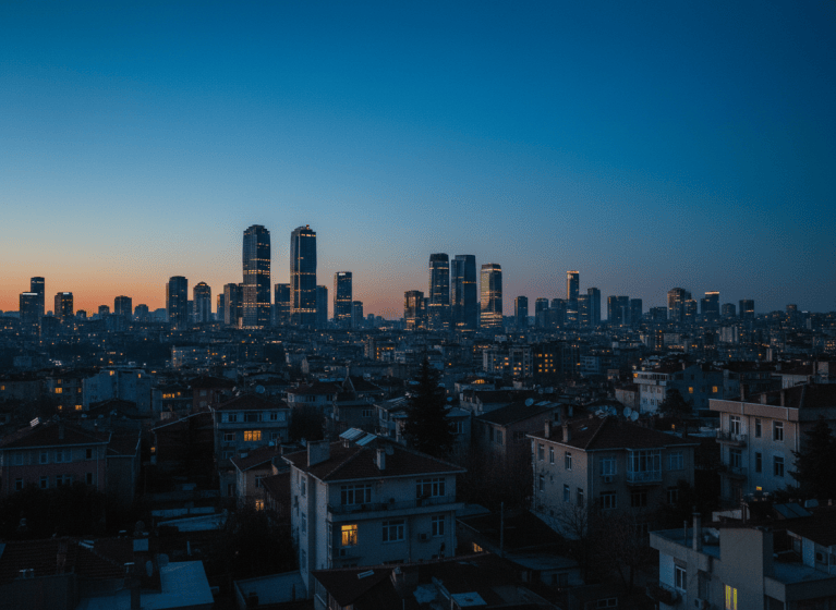 Office towers of Istanbul's Levent business district at blue hour, seen over residential rooftops